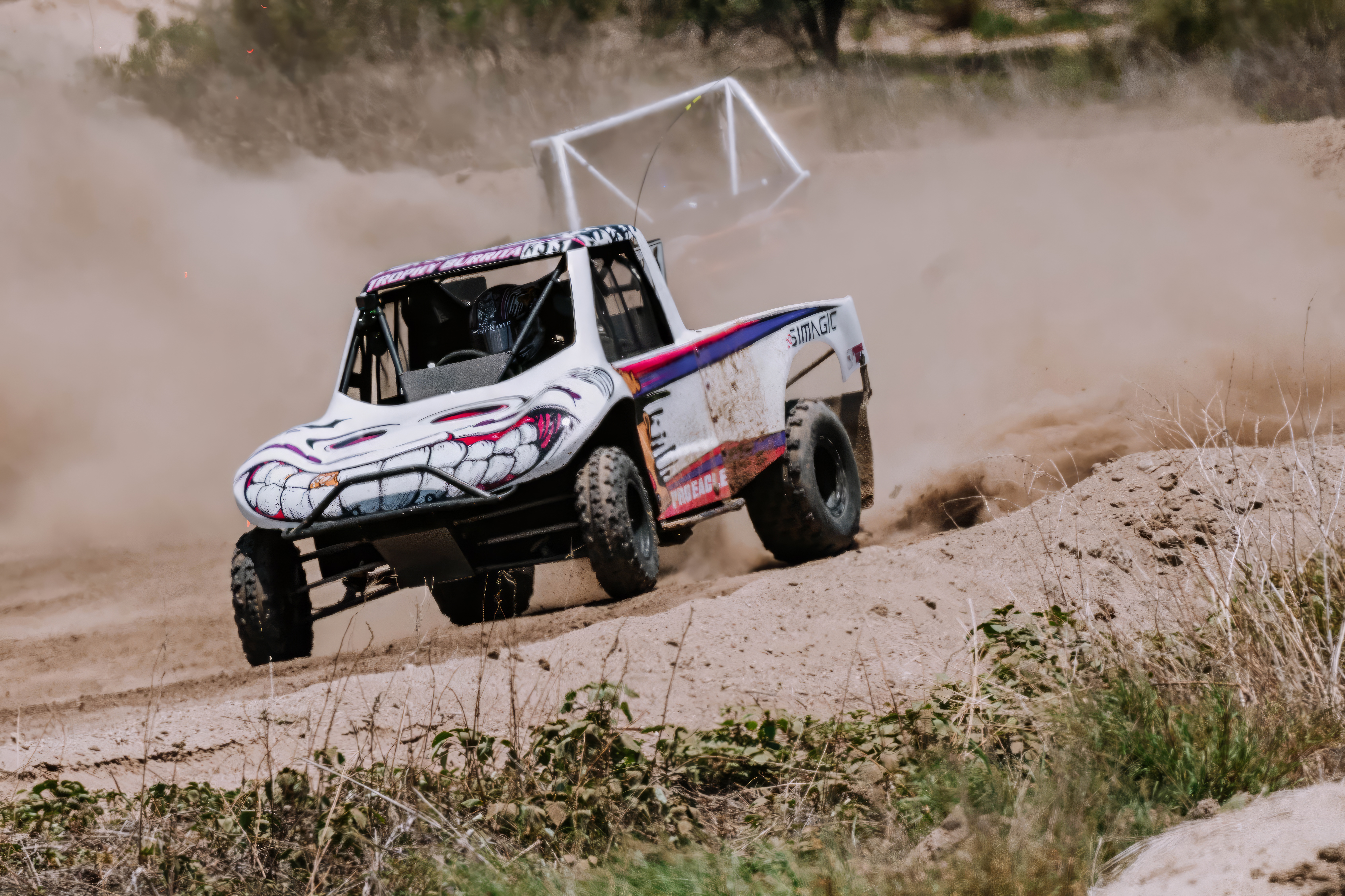 Trophy Burrita Open 450 Mod Kart racing hard through a dusty corner.
